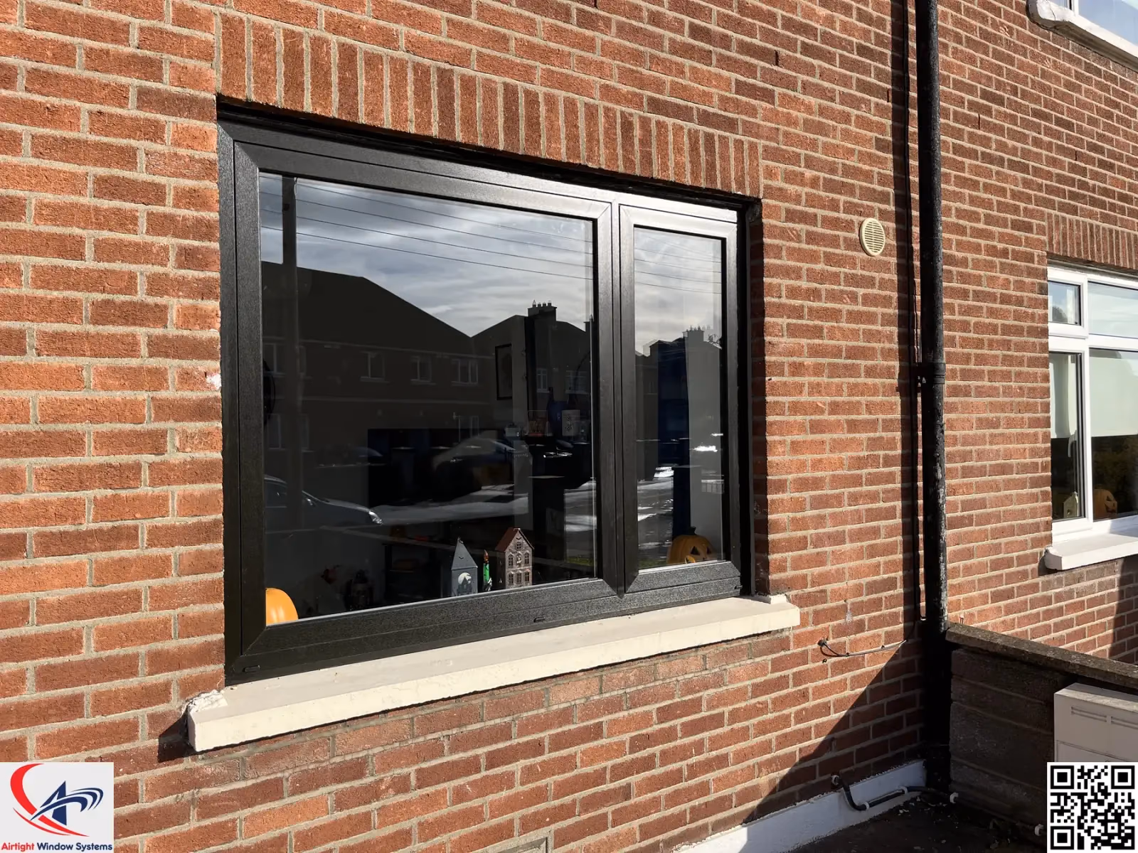 White flush-fit sash window on a period rendered terrace