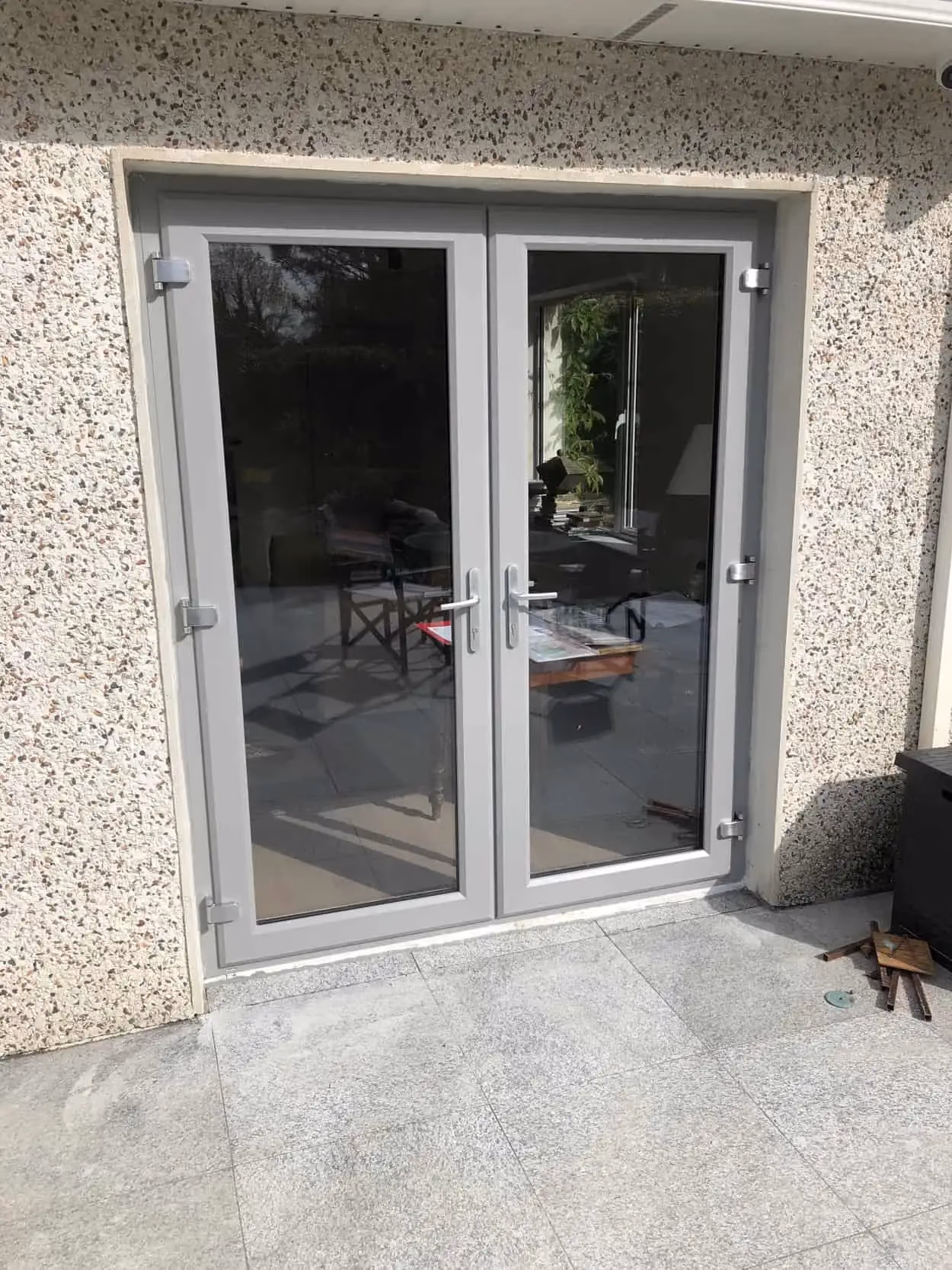 French doors fitted on a Dublin extension, with a kitchen visible inside