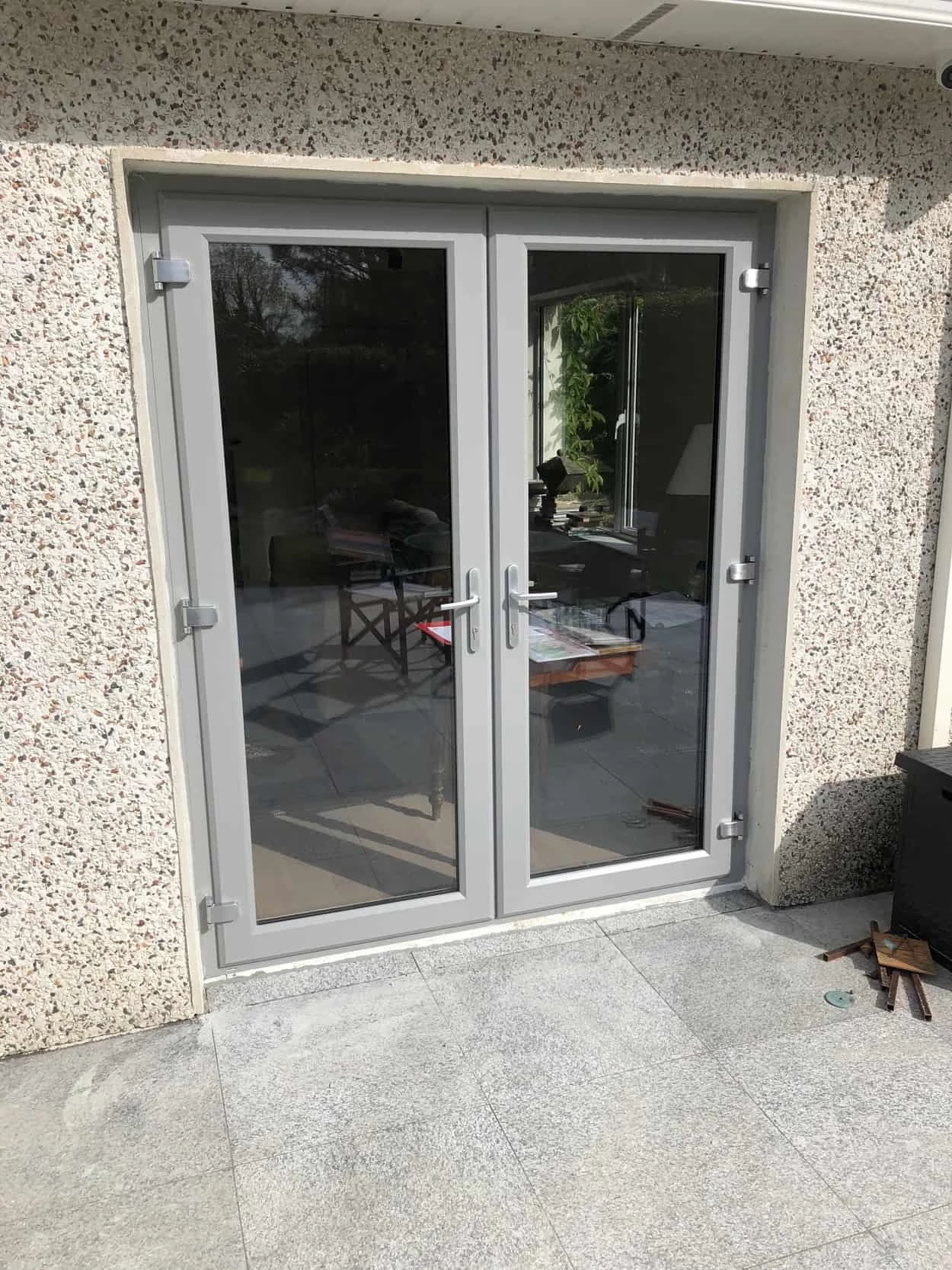 French doors fitted on a Dublin extension, with a kitchen visible inside