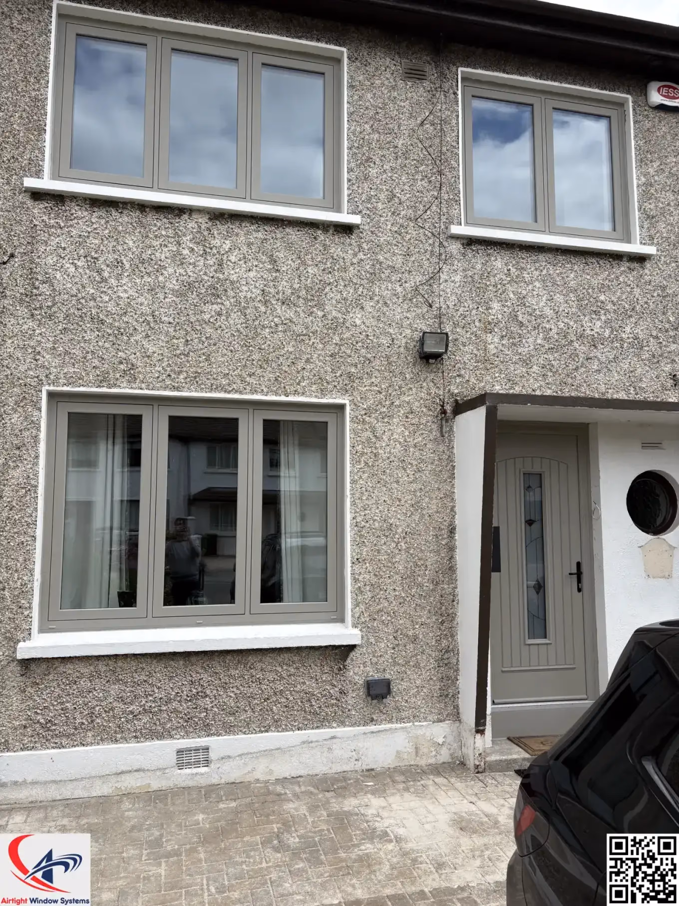 Timber-look uPVC sliding sash windows on a period Dublin townhouse