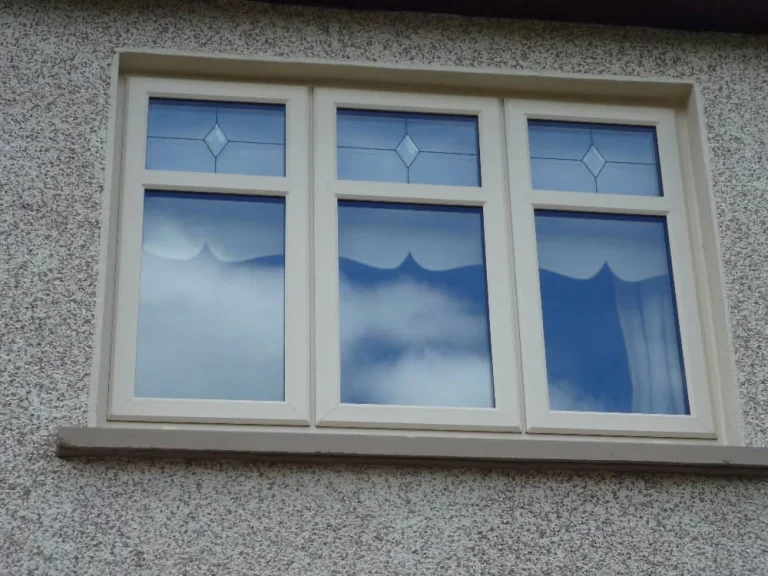 Triple Casement Window with diamond-pattern top panels
