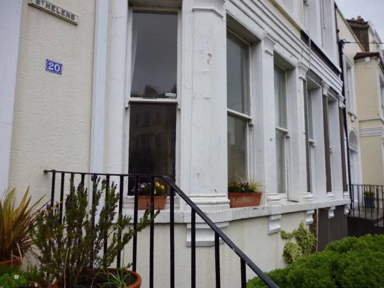 White townhouse with Triple Glazed window